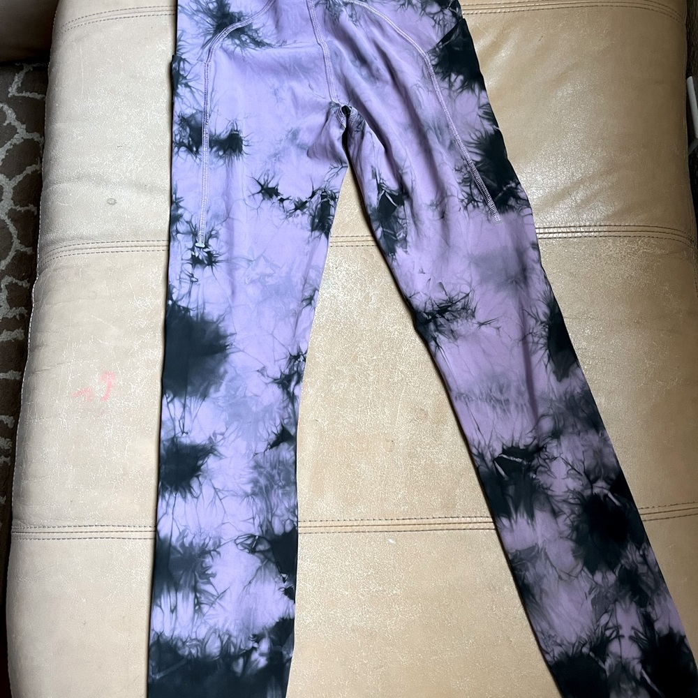 Lululemon lavender and black tights with side pockets. Great condition.